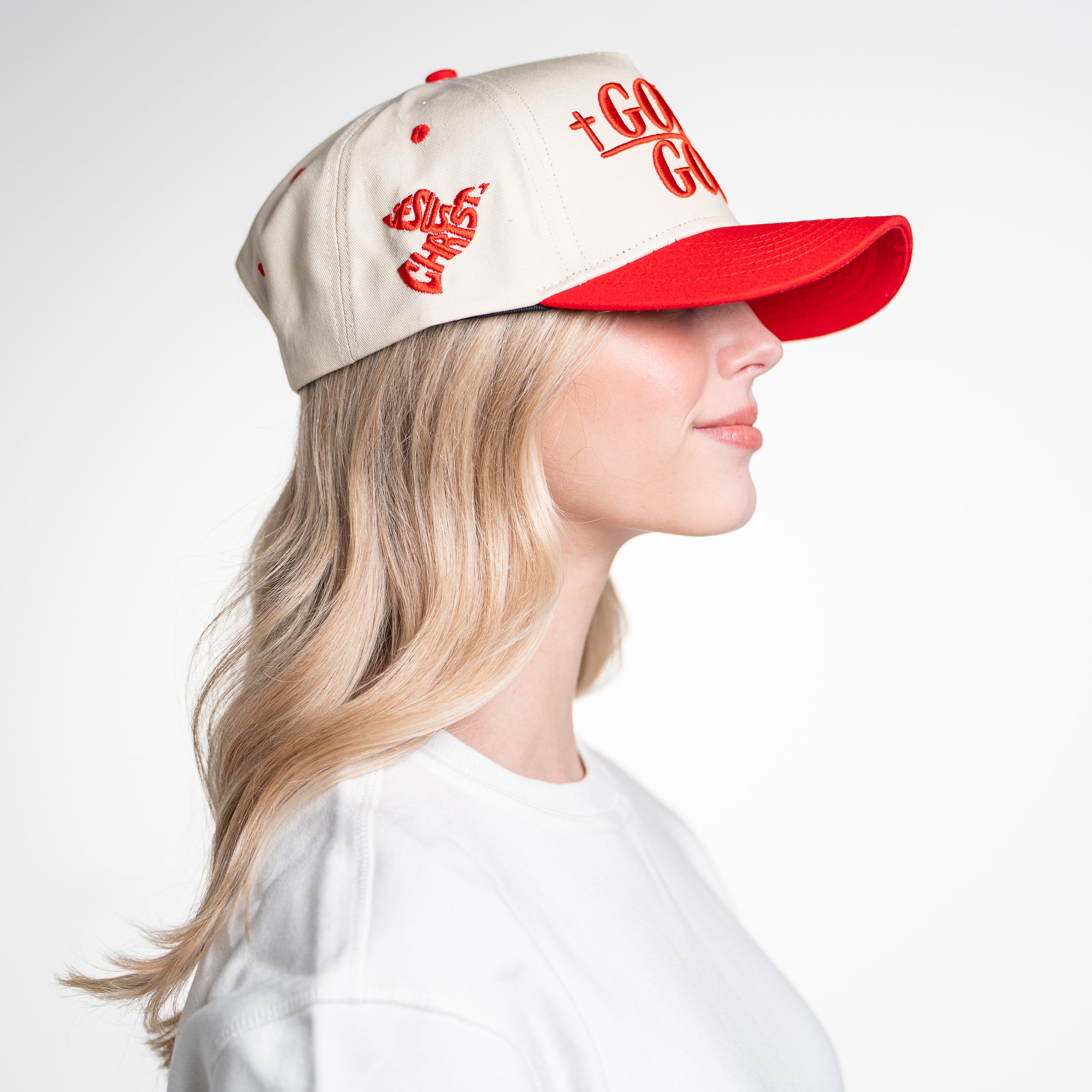Right side view of woman in God Is Good Hat, highlighting mesh back and snapback closure for adjustable comfort